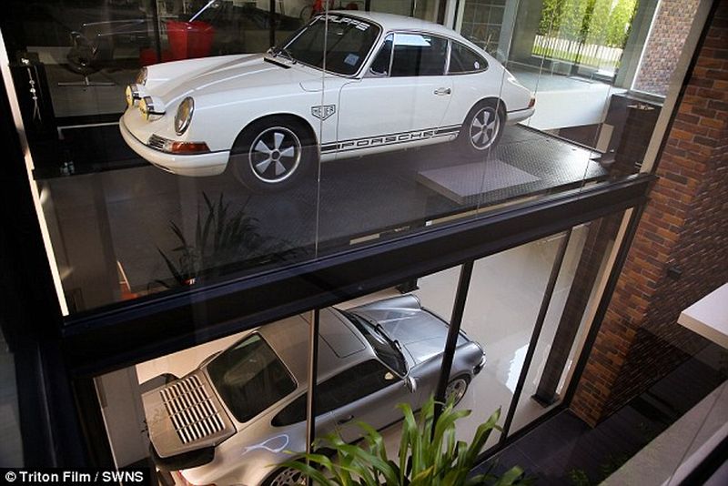 Thai Man Builds Glass Elevator In Lounge To Display His Porsche Cars