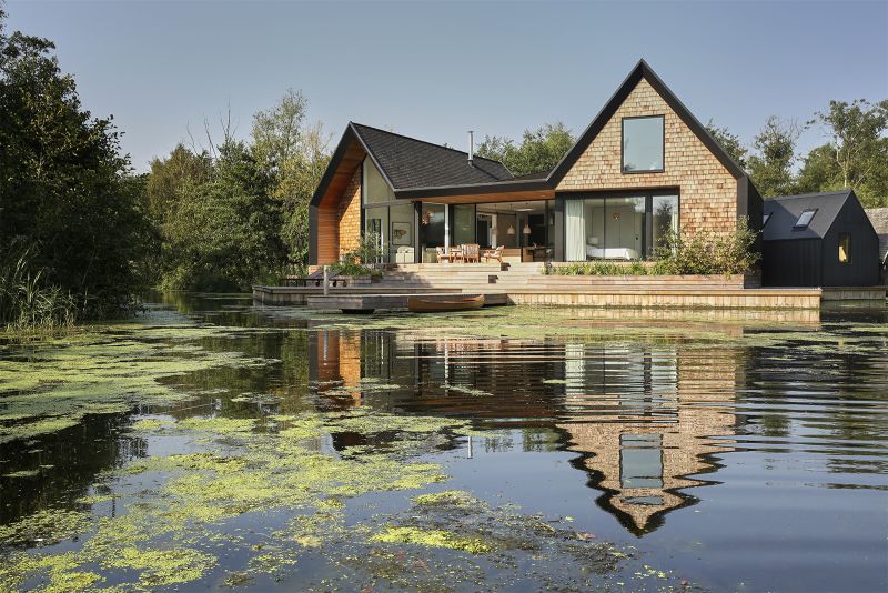 Backwater: Waterside house located across a private lagoon in Norfolk ...