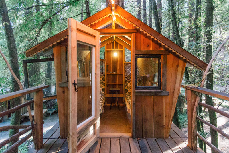 This boho style cabin comes with its own treehouse, zip lines